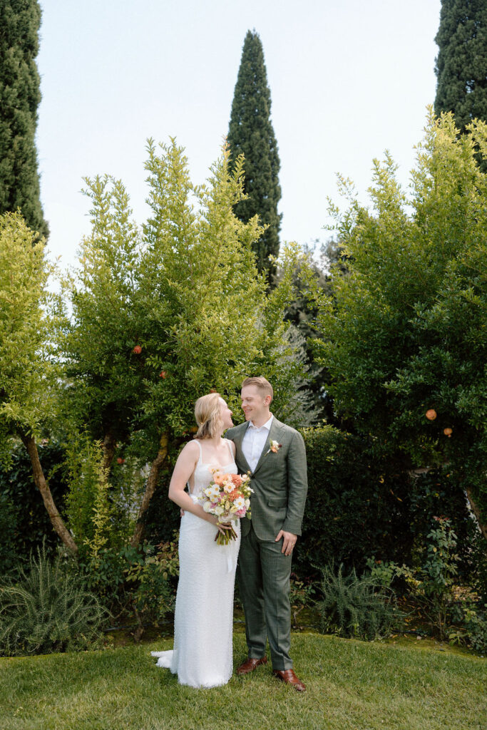 Emotional destination wedding ceremony in Tuscany as the couple shares vows in a quiet, meaningful setting.