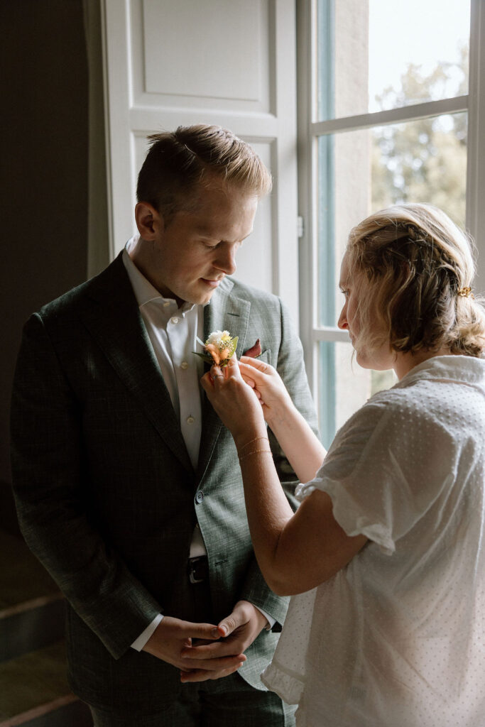 “Calm getting-ready moments before a Tuscan elopement, capturing the bride’s excitement and quiet joy.